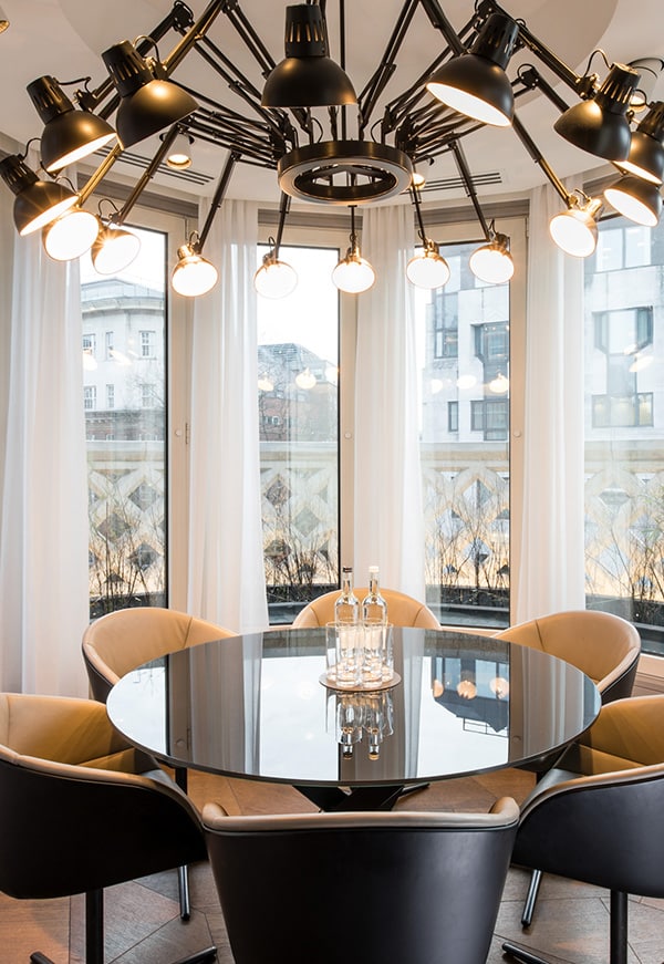 meeting room - round glass topped table and 6 modern leather chairs